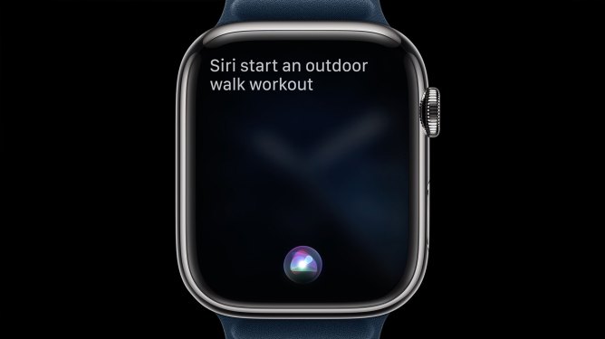 Apple watch series 9 face, Text reads "Siri start an outdoor walk workout"