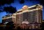 a photo of Caesars Palace Hotel sitting along Las Vegas Blvd, along the strip in Las Vegas, NV at night with the darkened sky