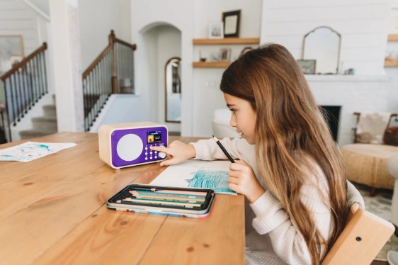 young girl listening to Storybutton podcast