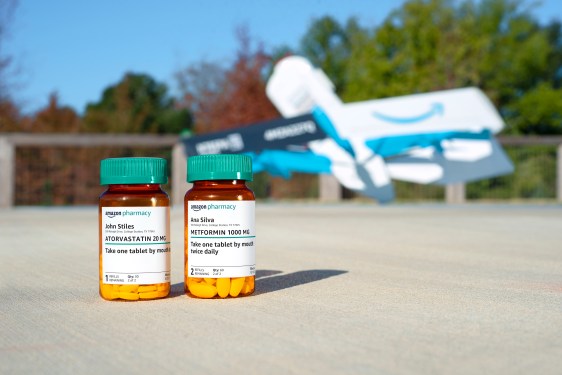 prescription bottles in front of Amazon Pharmacy prime air drone