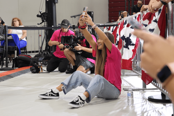Annie Wu Henry records during a campaign event.