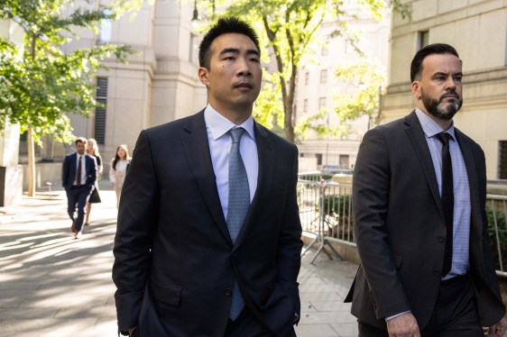 Matt Huang, co-founder and managing partner of Paradigm Operations LP, left, exits court in New York, US