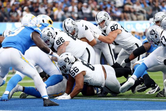 Aidan O'Connell #4 of the Las Vegas Raiders pushes into the end zone during the first quarter against the Los Angeles Chargers at SoFi Stadium on October 01, 2023 in Inglewood, California.