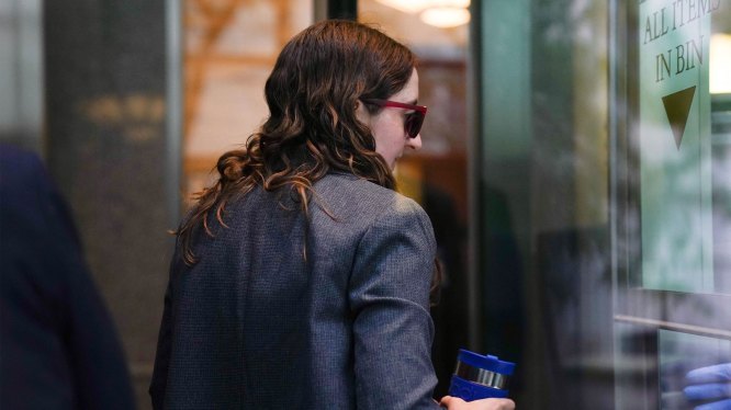 Sam Bankman-Fried's former girlfriend, Caroline Ellison, walks through security at Manhattan Federal Court on October 10, 2023, in New York, during the fraud trial against the FTX founder. Bankman-Fried, 31, once one of the most respected figures in crypto, now faces decades in prison and could see his name stand alongside Bernie Madoff and Elizabeth Holmes as the era's most prominent fraudsters. Bankman-Fried faces seven counts including wire fraud, securities and commodities fraud, and money laundering. He risks more than 100 years behind bars if he is found guilty on all charges. (Photo by BRYAN R. SMITH/AFP via Getty Images)