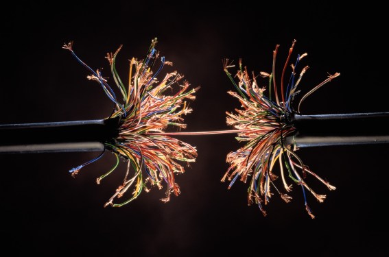 Single wire holding together frayed ends of model wiring harness