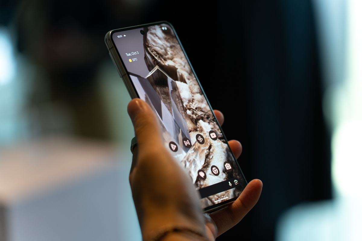 Google PIxel 8 Pro being held, showing display from an angle
