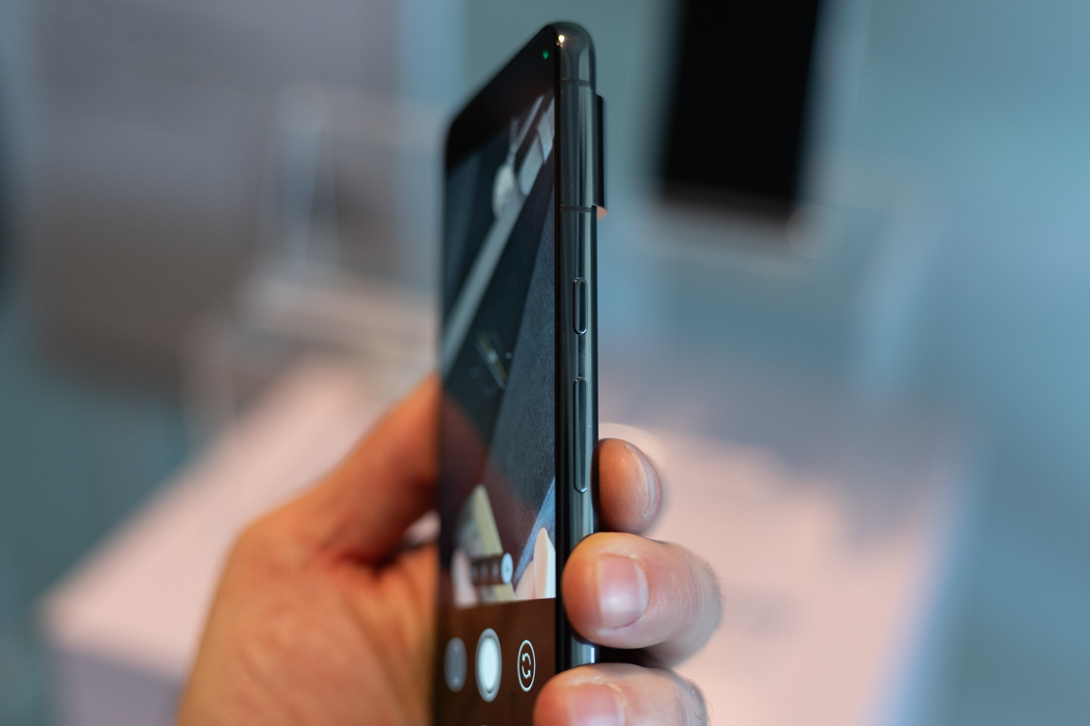 Google PIxel 8 Pro being held, showing the rounded side edges