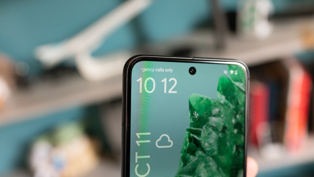 Google Pixel 8 close-u, showing the top of the screen and front camera module