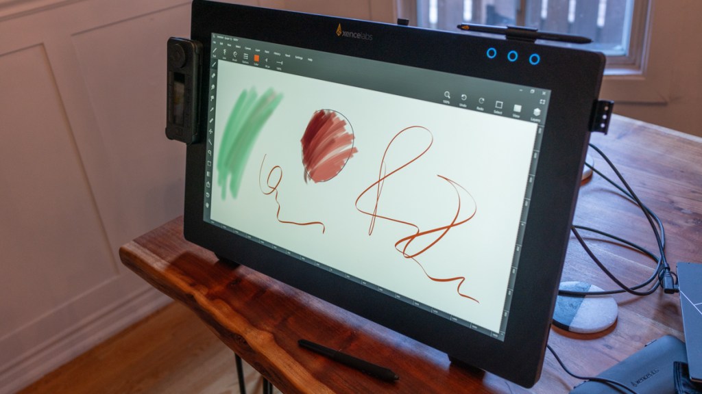 Xencelabs Pen Display 24 standing up on a table with the screen on
