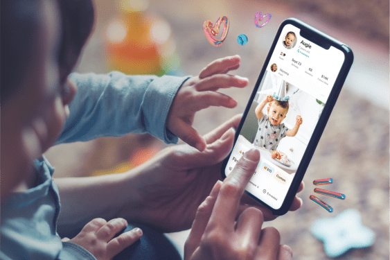 A parent and child hold a phone that displays EarlyBird on a smartphone
