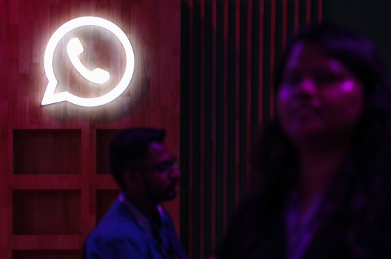 People walk past a logo of WhatsApp, during a Meta event in Mumbai, India, 20 September, 2023. (Photo by Niharika Kulkarni/NurPhoto via Getty Images)