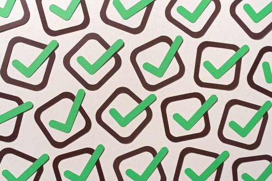 green check marks in brown boxes