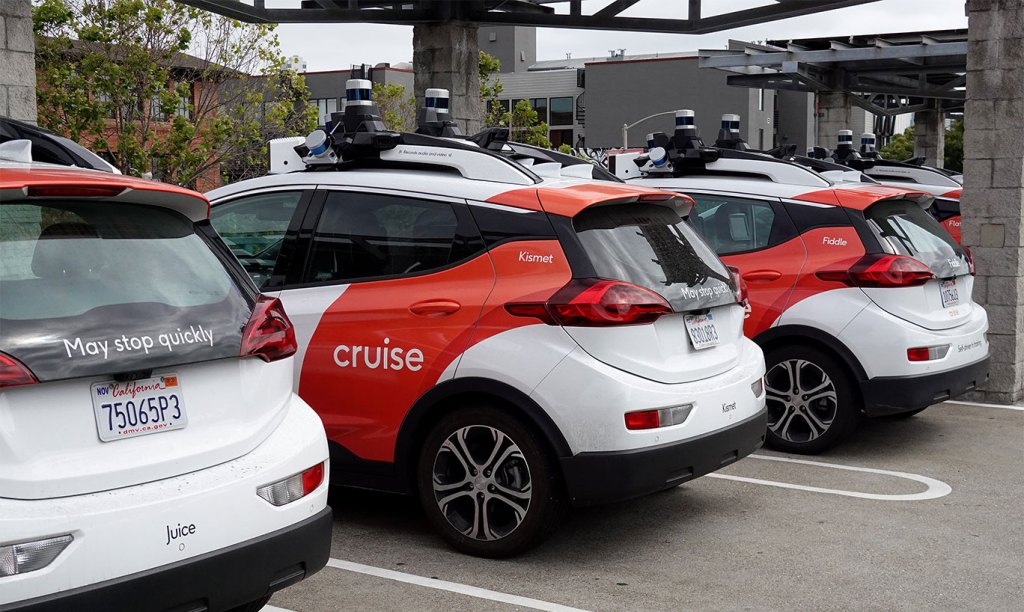 Chevrolet Cruise autonomous vehicles sit parked in a lot in San Francisco.