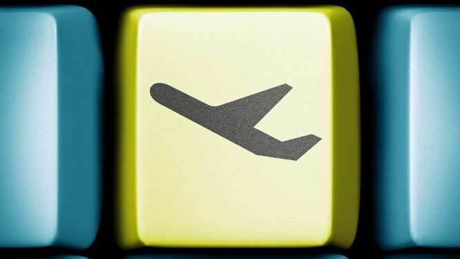 plane on a green key of a computer keyboard