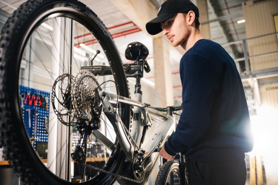 man fixing e-bike