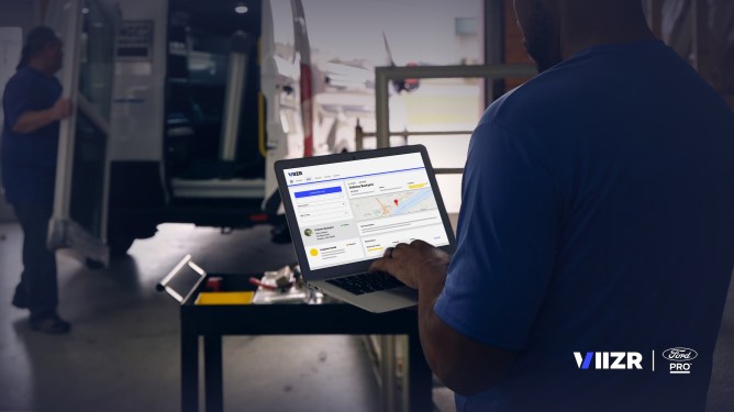 VIIZR - Ford Pro; person seated, using laptop