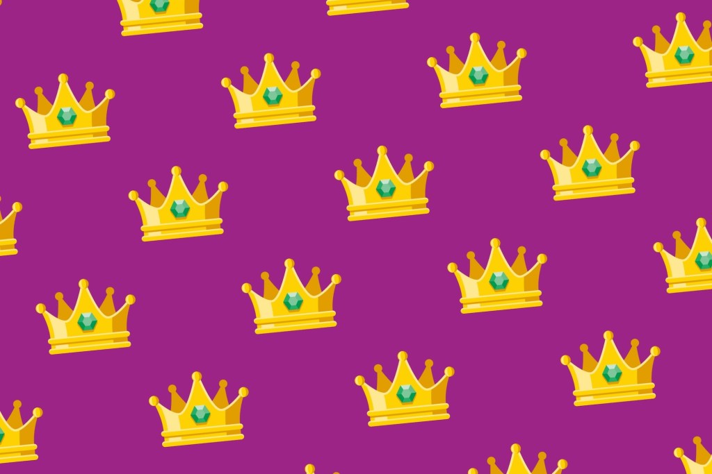 A seamless pattern of yellow jeweled crowns on a purple background