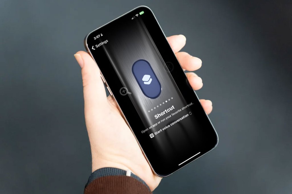 hand holding an iPhone 15