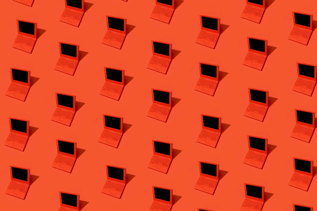 High angle view of some red laptops on red background