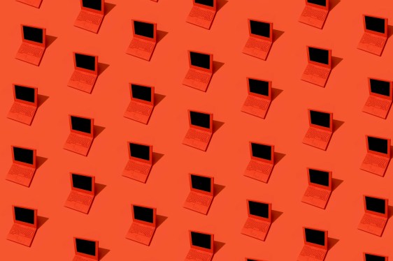 High angle view of some red laptops on red background