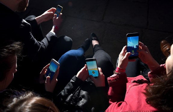 overhead view of people using smartphones