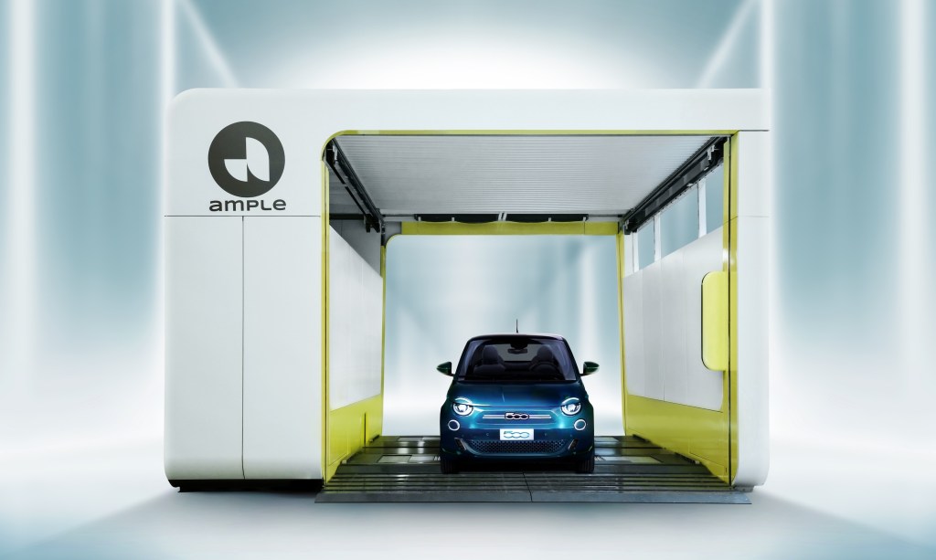 A Fiat 500e swaps batteries at an Ample station.