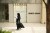 A woman walks past a Giorgio Armani shop at an upscale shopping center in Jeddah, Saudi Arabia.