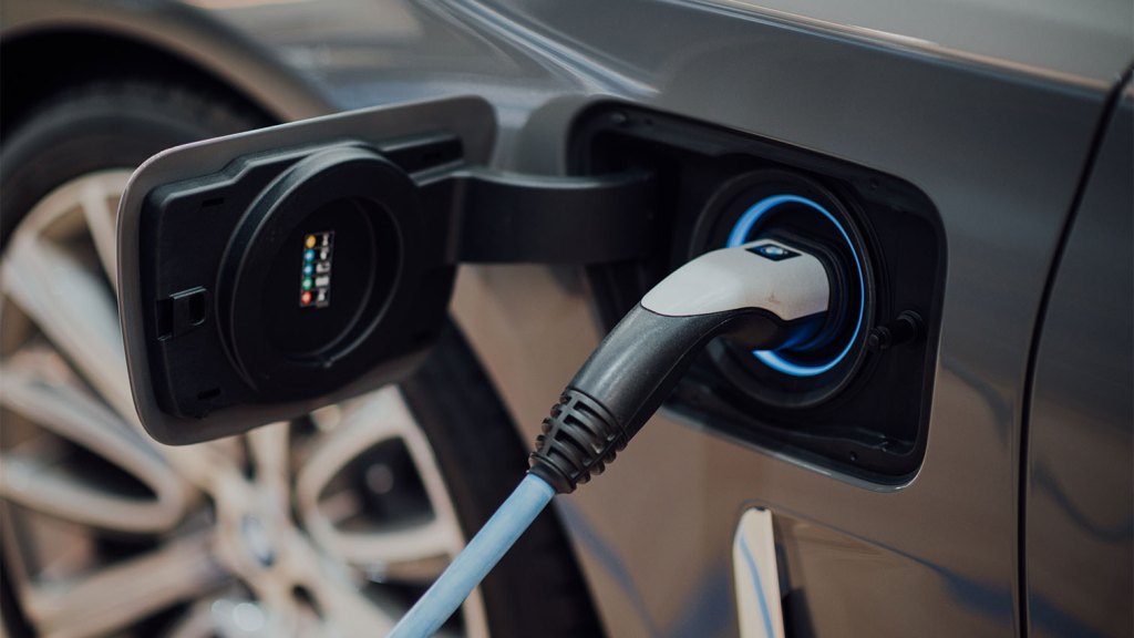 charging cable connected to electric vehicle