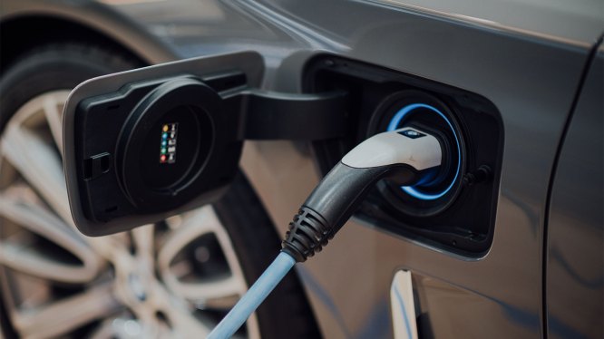 charging cable connected to electric vehicle