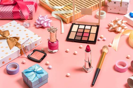 array of makeup scattered on table