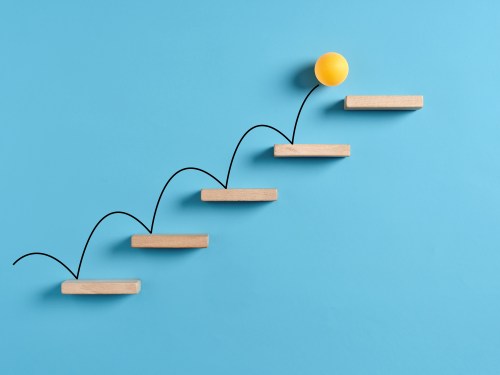 yellow ball bouncing up stairs