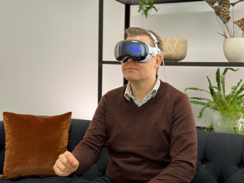 man seated, sporting Apple Vision Pro