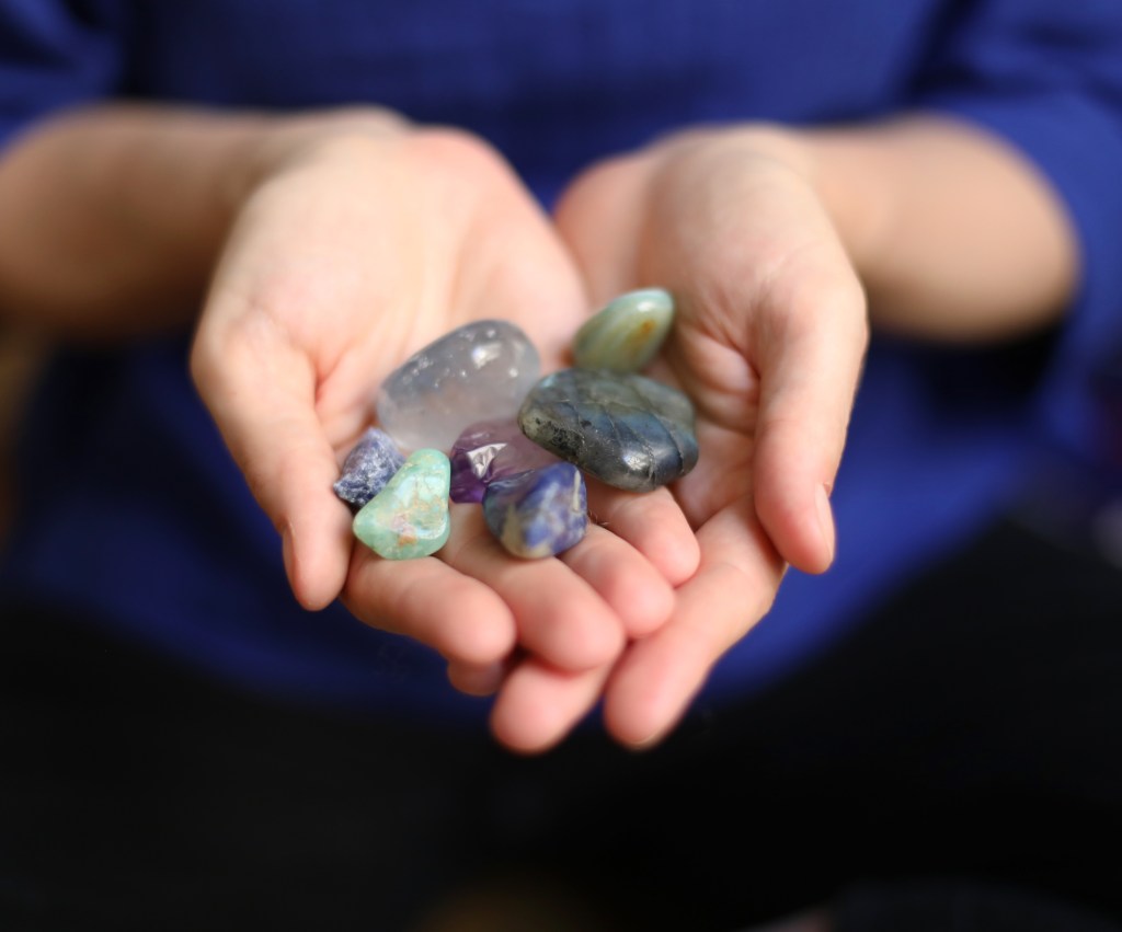 Close-Up Of Gemstones in the hands of a woman