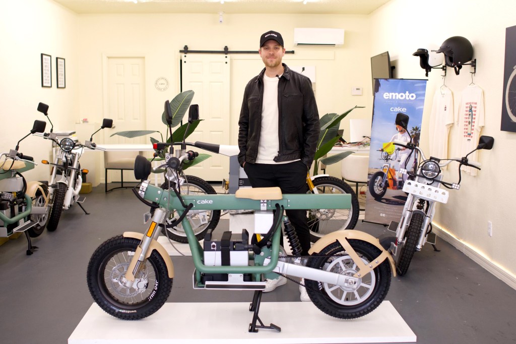 Michael Joyce of Emoto standing near Cake e-bikes.