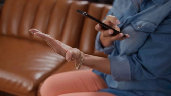 woman scanning palm using Amazon One app