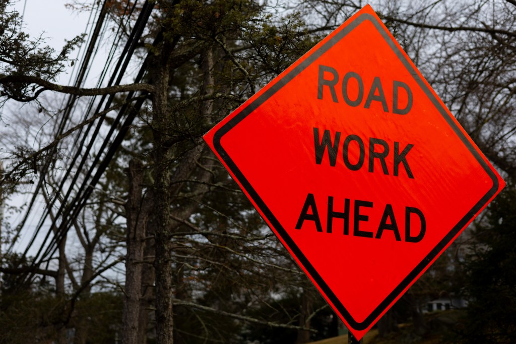 Big organge 'Road Work Ahead' sign
