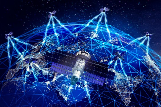 Satellites in earth orbit over blue tinted earth.