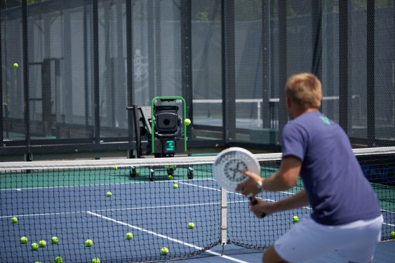 man using Volley's AI-enabled ball machine for racquet sports