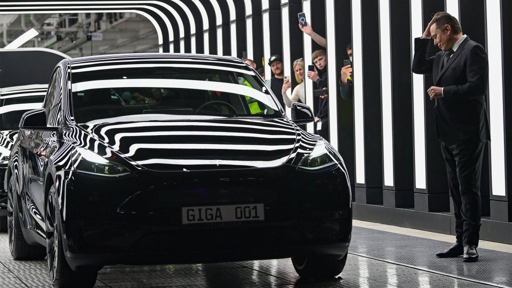 Tesla CEO Elon Musk is pictured as he attends the start of the production at Tesla's "Gigafactory" on March 22, 2022 in Gruenheide, southeast of Berlin. - US electric car pioneer Tesla received the go-ahead for its "gigafactory" in Germany on March 4, 2022, paving the way for production to begin shortly after an approval process dogged by delays and setbacks. (Photo by PATRICK PLEUL/POOL/AFP via Getty Images)