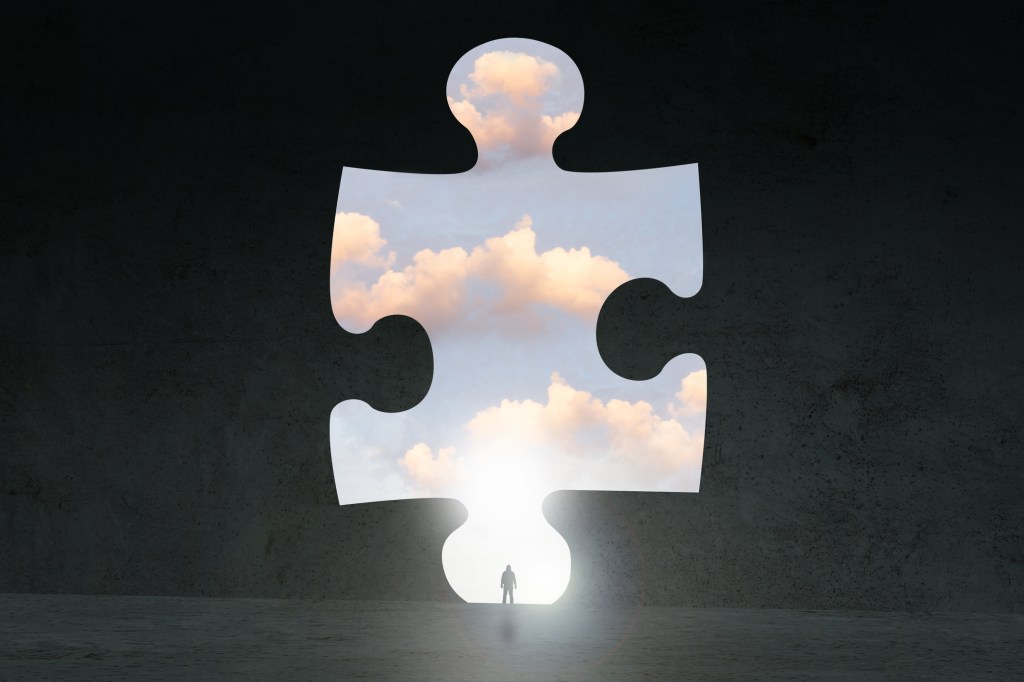 Puzzle piece pulled out to reveal cloud behind it.