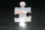 Puzzle piece pulled out to reveal cloud behind it.
