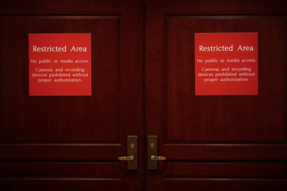 Doors to the Sensitive Compartmented Information Facility (SCIF) are seen where closed-door hearings
