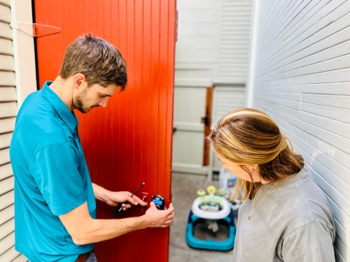 Handyman working on door hardware