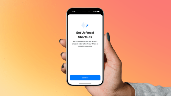 hand holding iphone with Apple's new accessibility features on orange background
