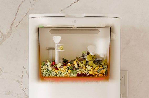 Mill bin grinding food waste in a cutaway view.