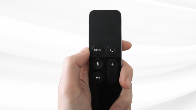 hand holding a remote