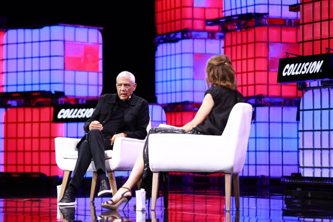 Vinod Khosla on stage at Collision with TechCrunch editor-in-chief Connie Loizos.