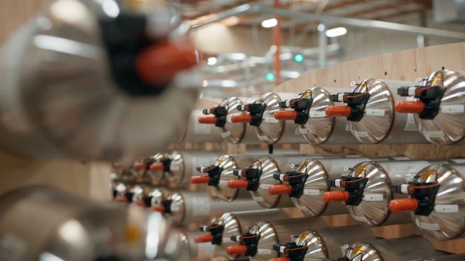 EnerVenue batteries stacked in a warehouse.