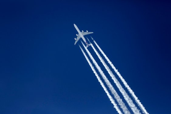 Jet plane leaving contrails in the sky.