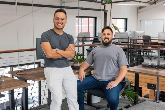 2 men sitting in office